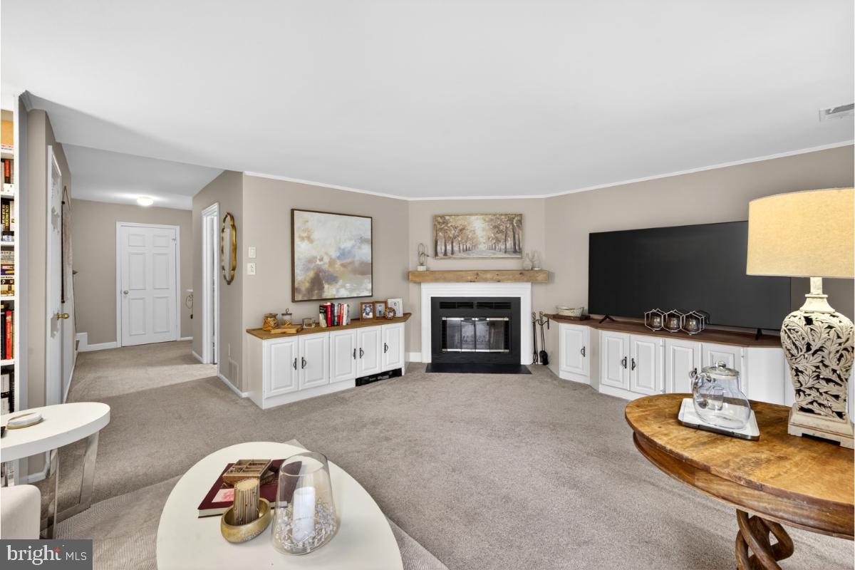 7347 Swan Point Way, Unit 122 Columbia, MD 21045 - Photo 35 of 54 a living room with furniture and a flat screen tv