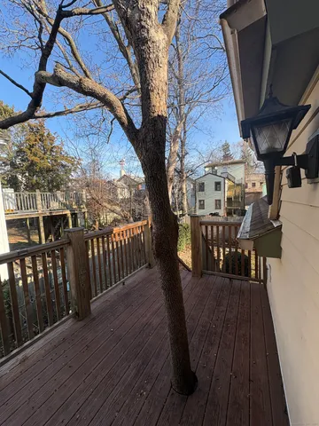 a view of a balcony with chairs