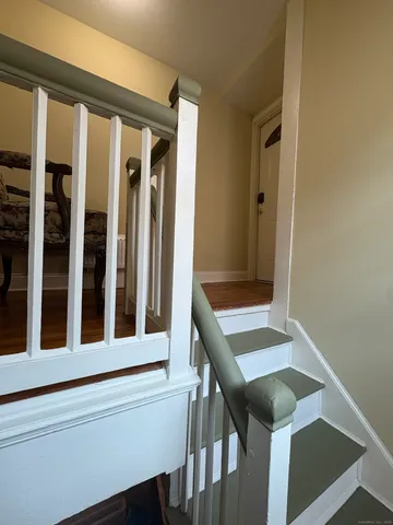 a view of a hallway with seating area