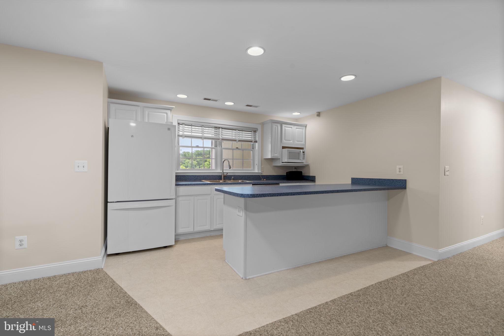 798 Creek View Road Severna Park, MD 21146 - Photo 47 of 72 a kitchen with white cabinets and white appliances