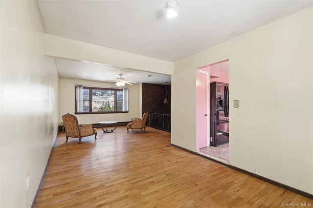a view of a livingroom with furniture and a workspace