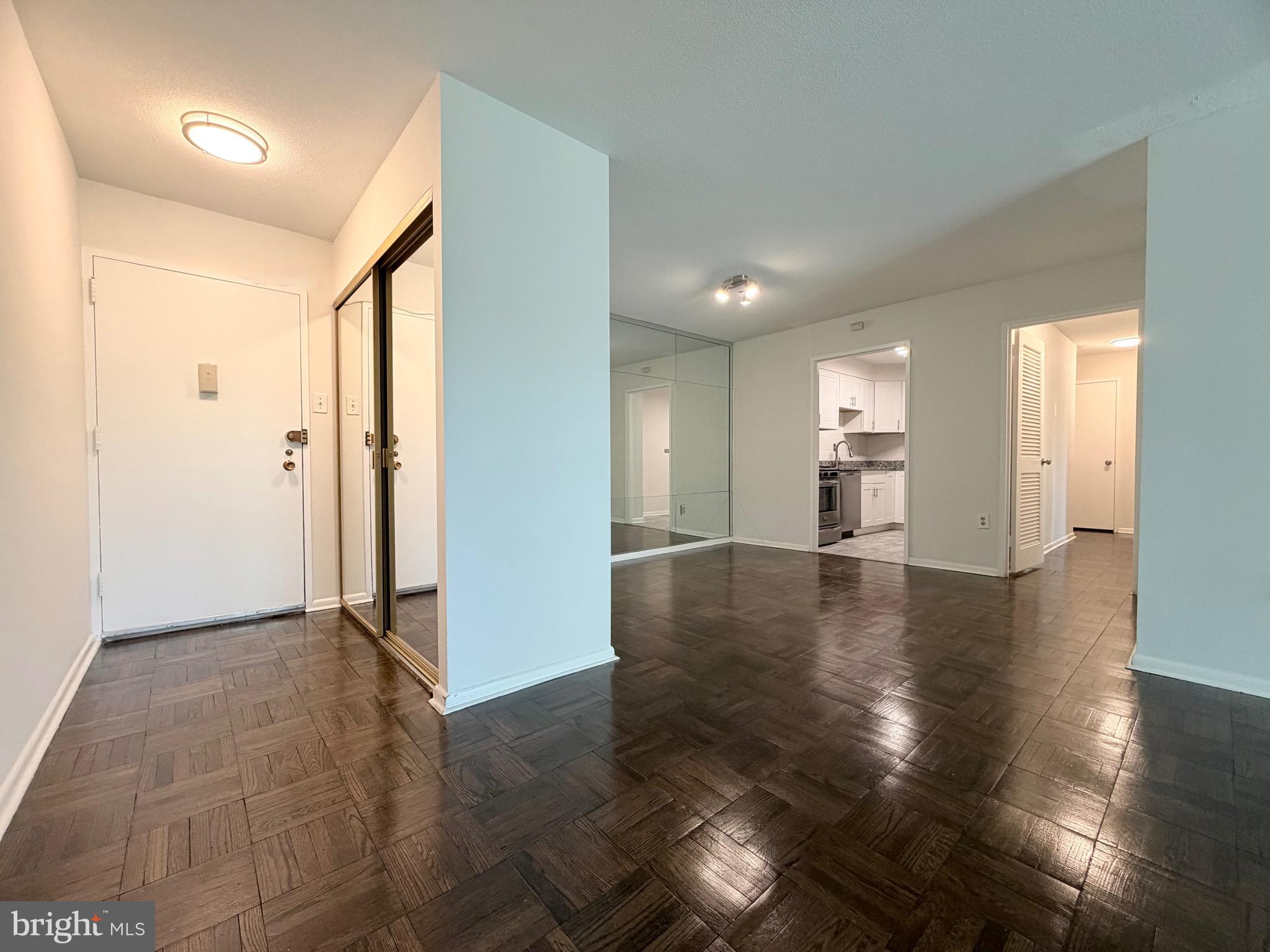 700 7th Street Southwest, Unit 406 Washington, DC 20024 - Photo 17 of 50 a view of a hallway with wooden floor