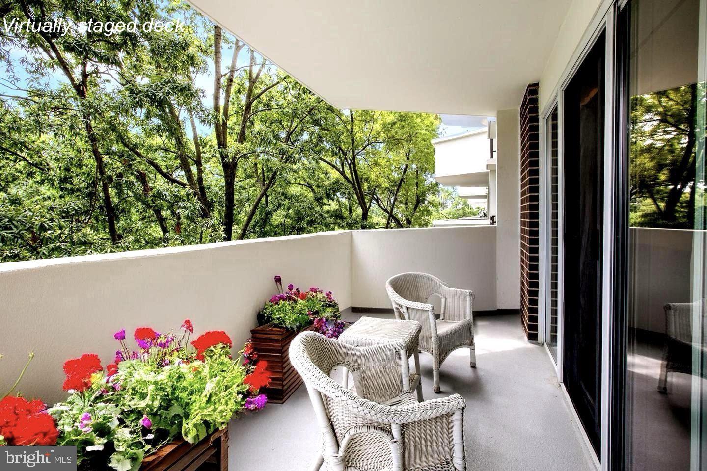 700 7th Street Southwest, Unit 406 Washington, DC 20024 - Photo 29 of 50 a view of chair and flowers in the balcony