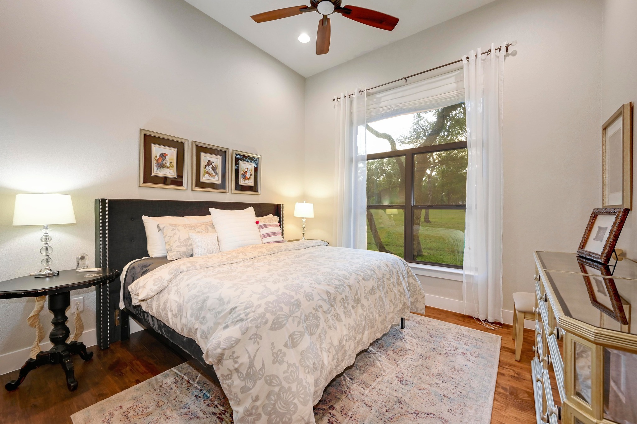 401 Trail Ridge Road Wimberley, TX 78676 - Photo 14 of 34 Bedroom with wood finished floors and ceiling fan
