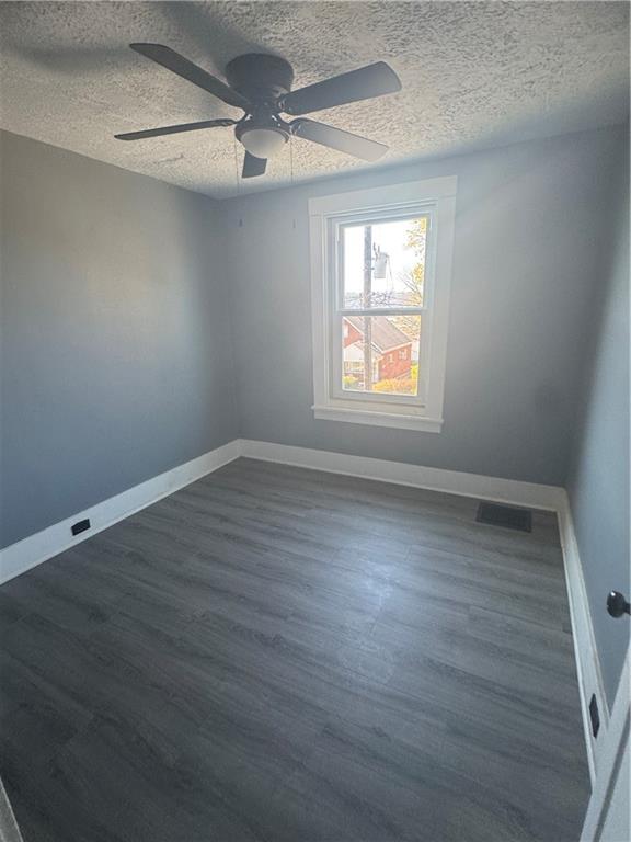546 Ridge Avenue New Kensington, PA 15068 - Photo 12 of 14 an empty room with wooden floor and windows