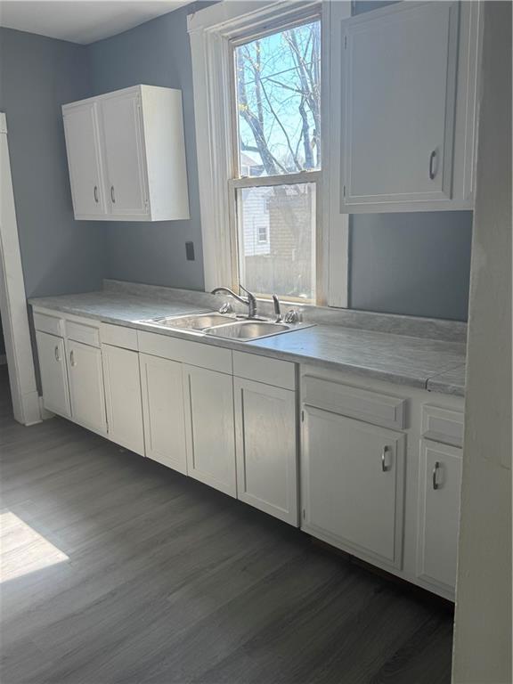 546 Ridge Avenue New Kensington, PA 15068 - Photo 7 of 14 a kitchen with white cabinets and sink
