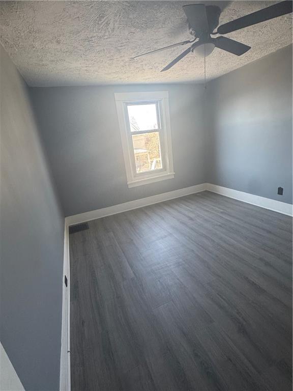546 Ridge Avenue New Kensington, PA 15068 - Photo 10 of 14 an empty room with wooden floor chandelier fan and windows