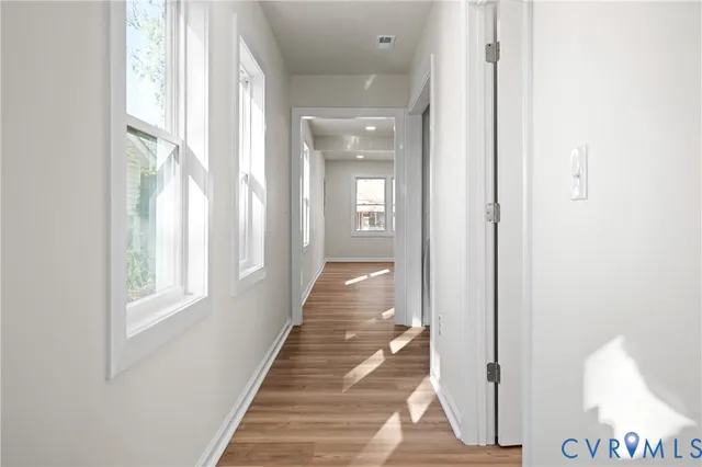 a view of a hallway with windows