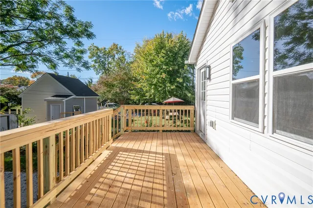 a view of a balcony with wooden floor