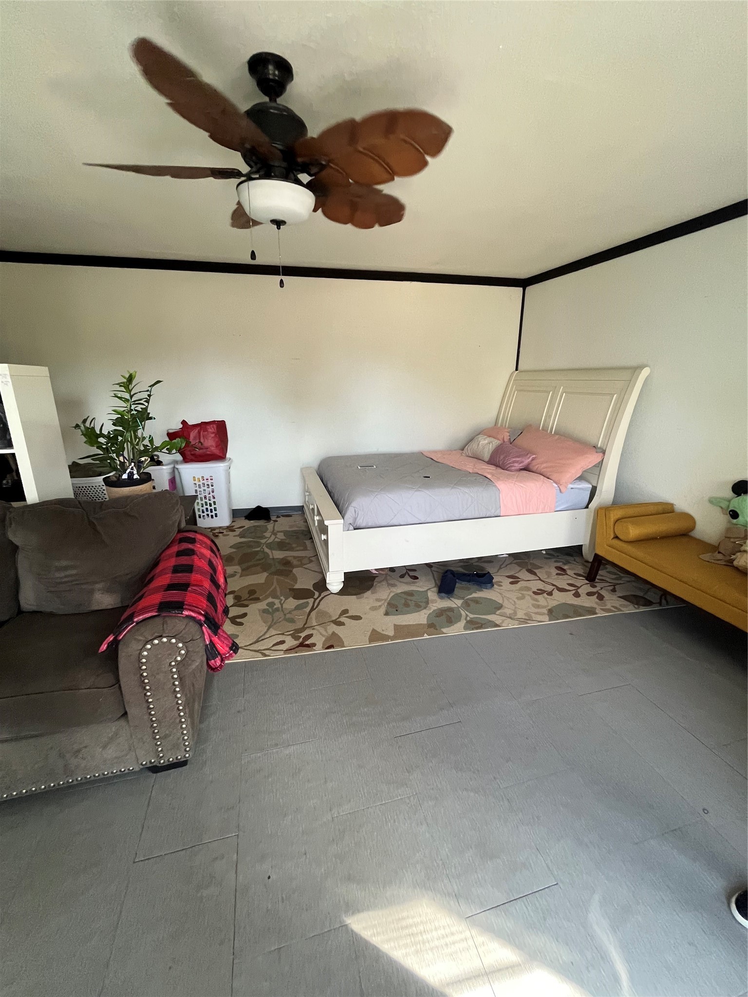 8026 Forest Trace Conroe, TX 77306 - Photo 23 of 28 a bedroom with a bed and a chandelier