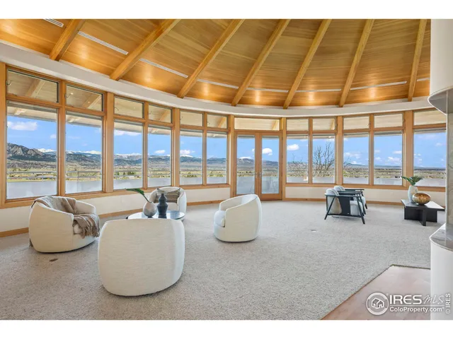 a lobby with furniture and floor to ceiling window