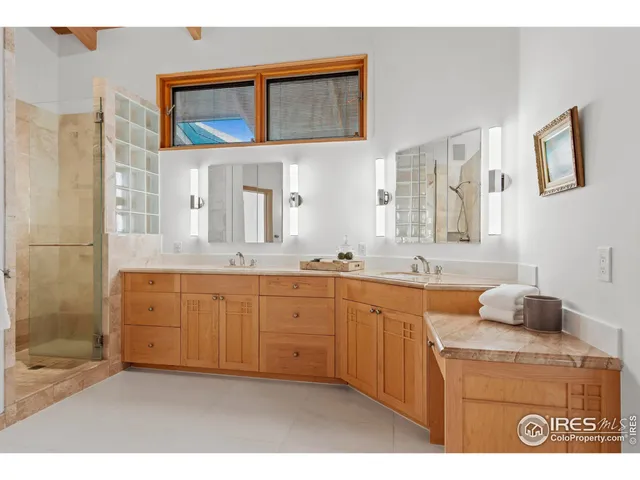 a spacious bathroom with a sink a mirror and a bathtub