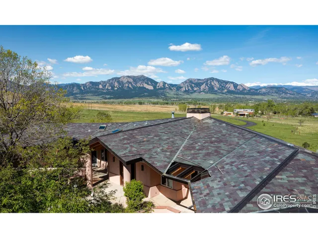 a view of a swimming pool and an outdoor seating