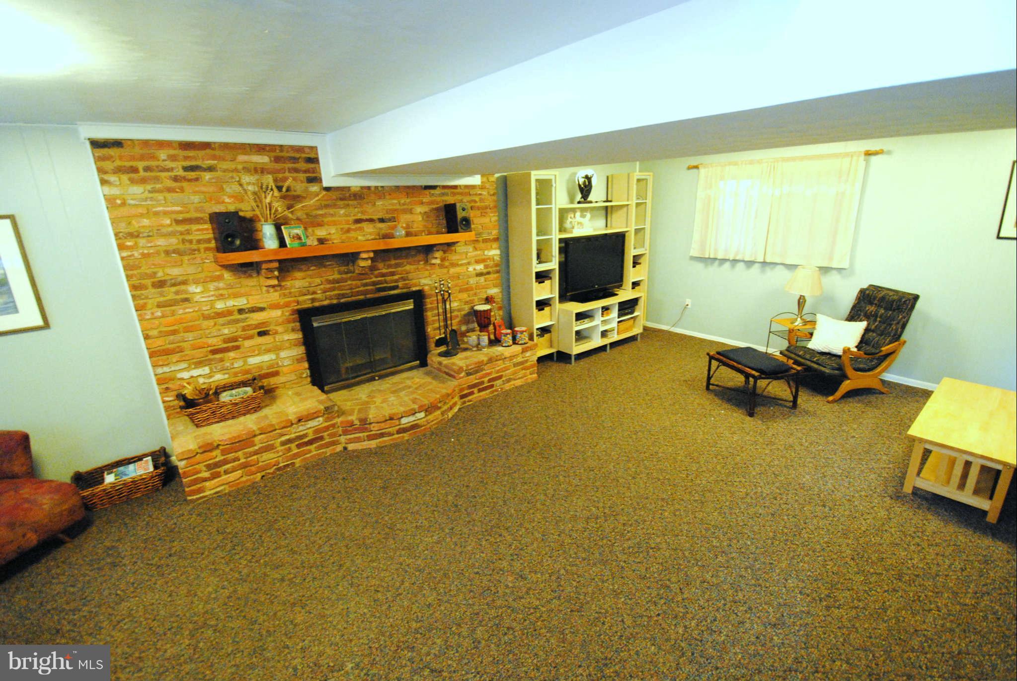 1012 Wallace Road Crownsville, MD 21032 - Photo 22 of 30 Family room with wood burning fireplace