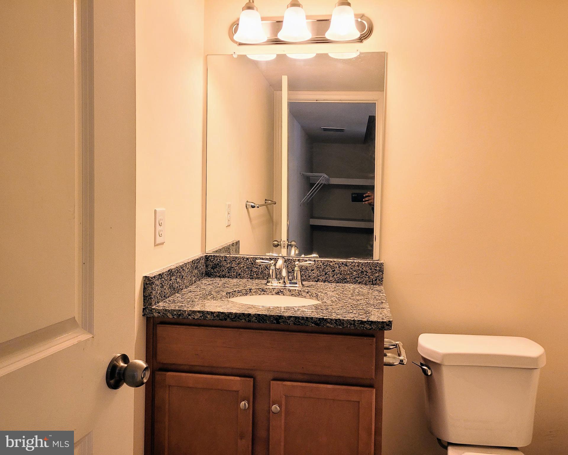 628 Rigel Way Bear, DE 19701 - Photo 19 of 20 a bathroom with a granite countertop sink toilet and mirror