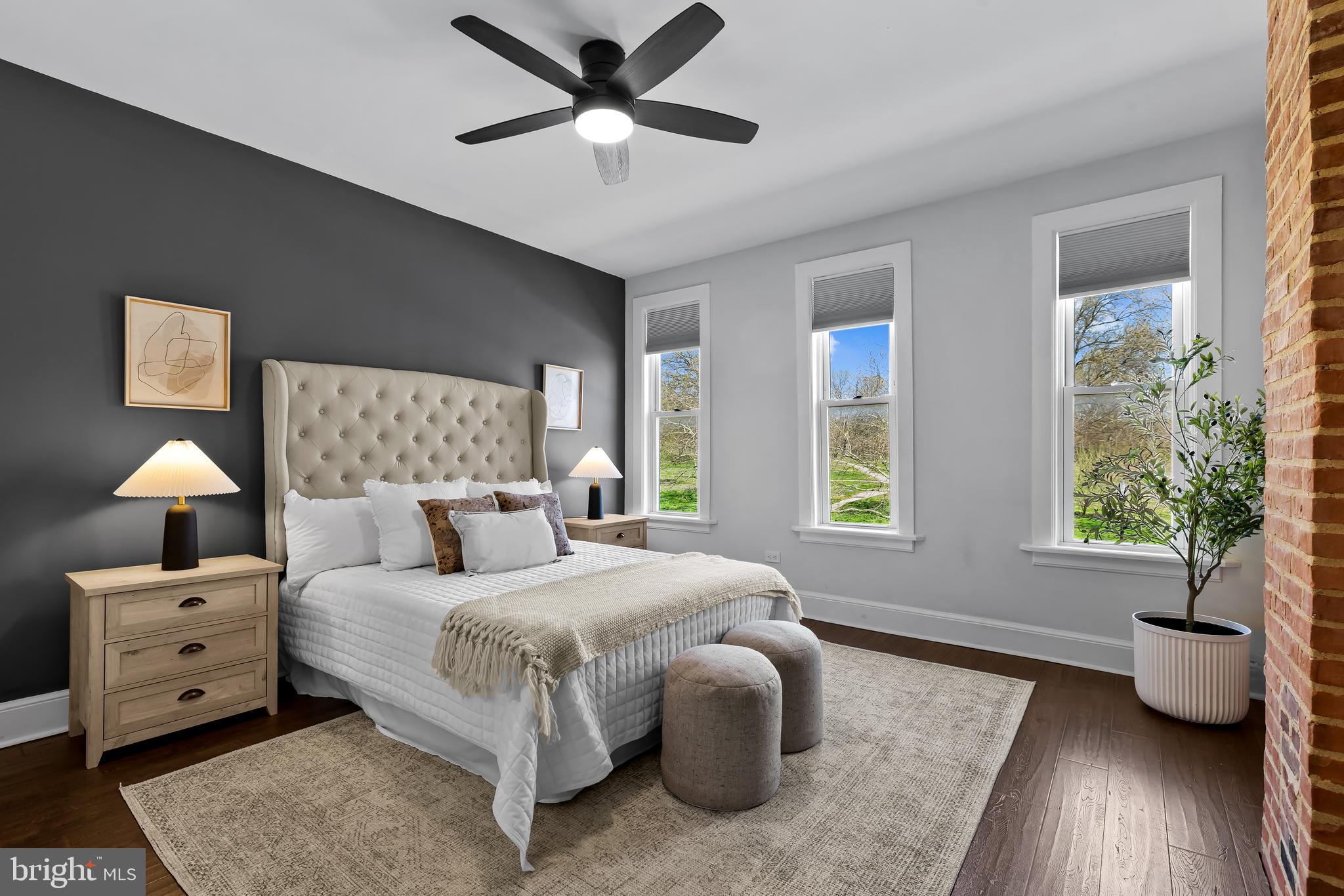 2529 Eastern Avenue Baltimore, MD 21224 - Photo 21 of 50 a bedroom with a bed and a chandelier