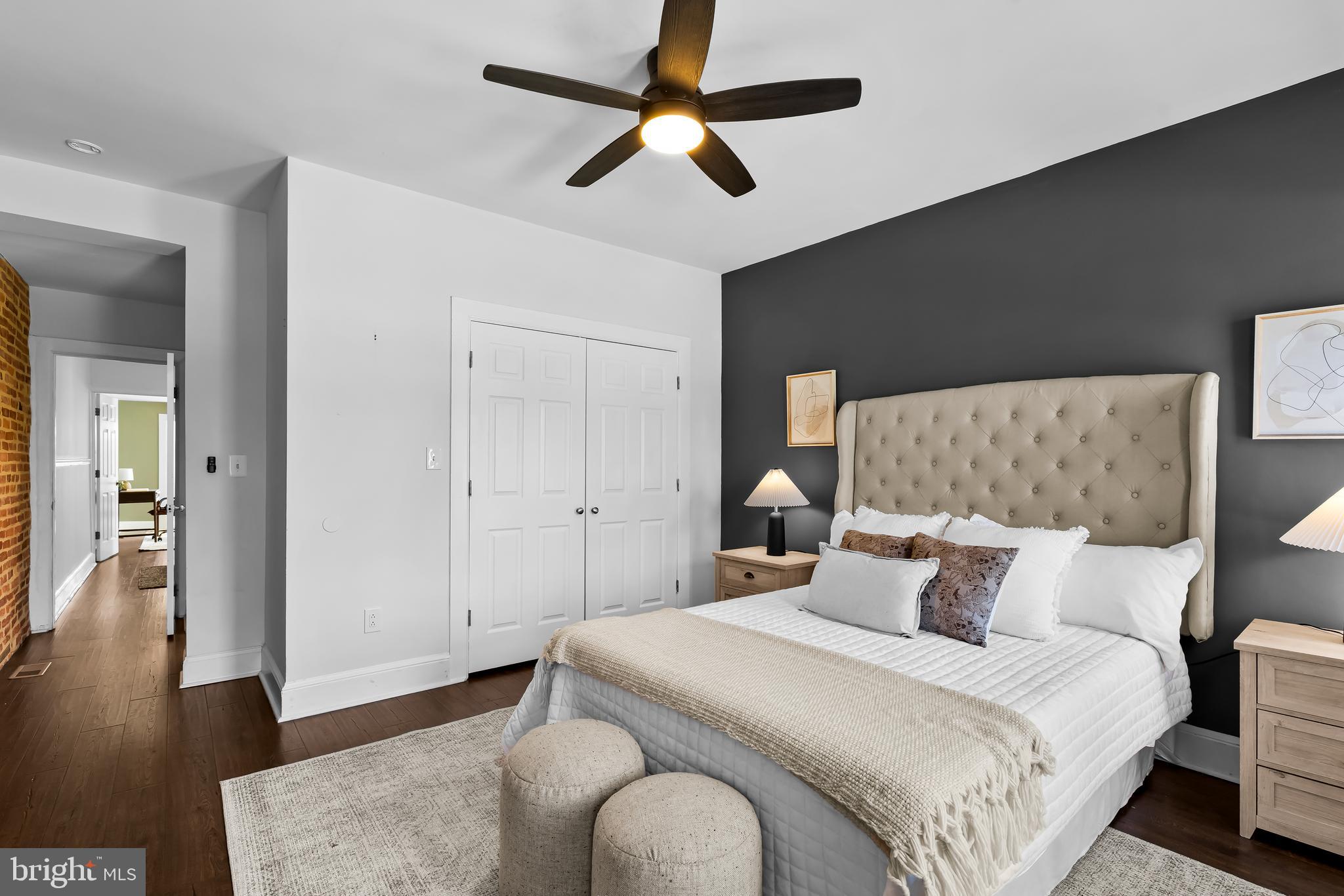 2529 Eastern Avenue Baltimore, MD 21224 - Photo 23 of 50 a bedroom with bed and a chandelier