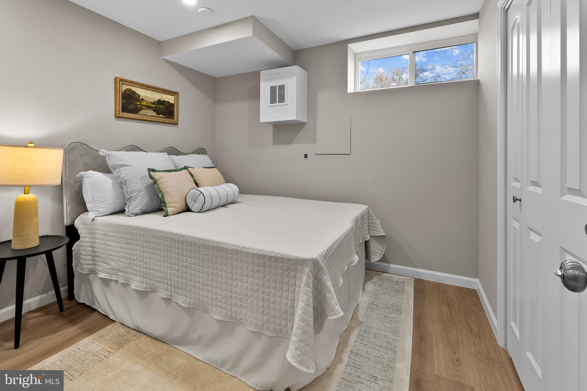 2529 Eastern Avenue Baltimore, MD 21224 - Photo 36 of 50 a bedroom with a bed and a night stand