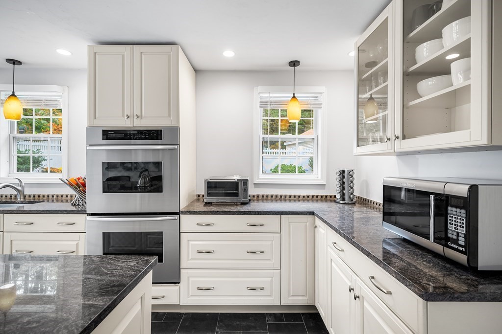 9 Tucker Lane Sutton, MA 01590 - Photo 15 of 33 a kitchen with stainless steel appliances granite countertop a stove and a sink