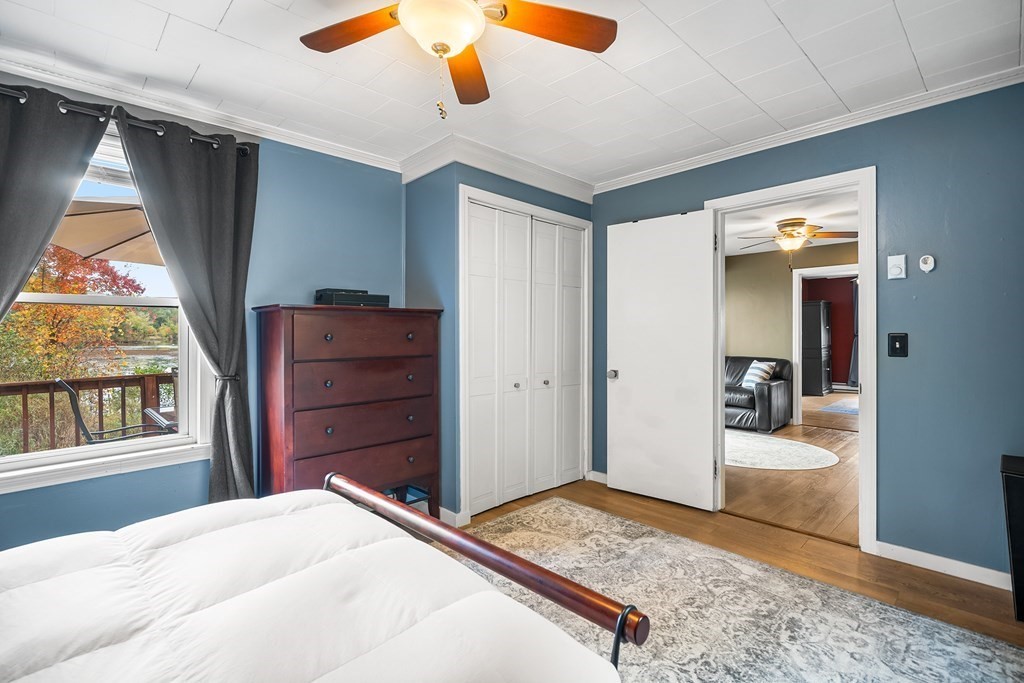 9 Tucker Lane Sutton, MA 01590 - Photo 18 of 33 a bedroom with a bed and a dresser