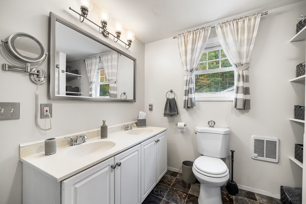9 Tucker Lane Sutton, MA 01590 - Photo 21 of 33 a bathroom with a toilet sink and mirror