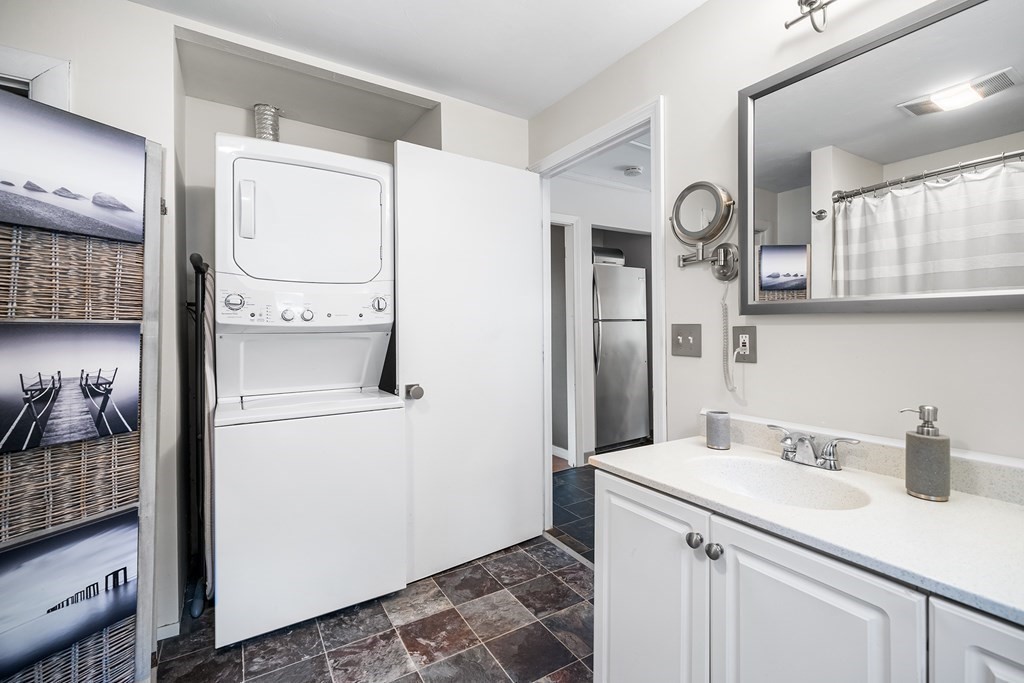9 Tucker Lane Sutton, MA 01590 - Photo 23 of 33 a kitchen with a sink and refrigerator