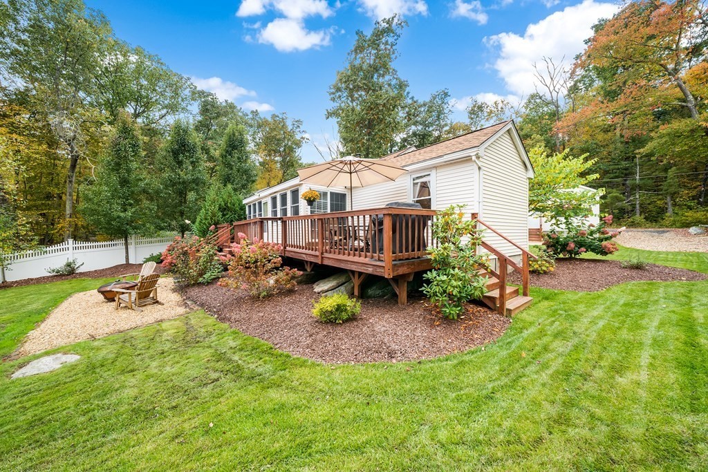 9 Tucker Lane Sutton, MA 01590 - Photo 24 of 33 a view of a house with backyard porch and sitting area