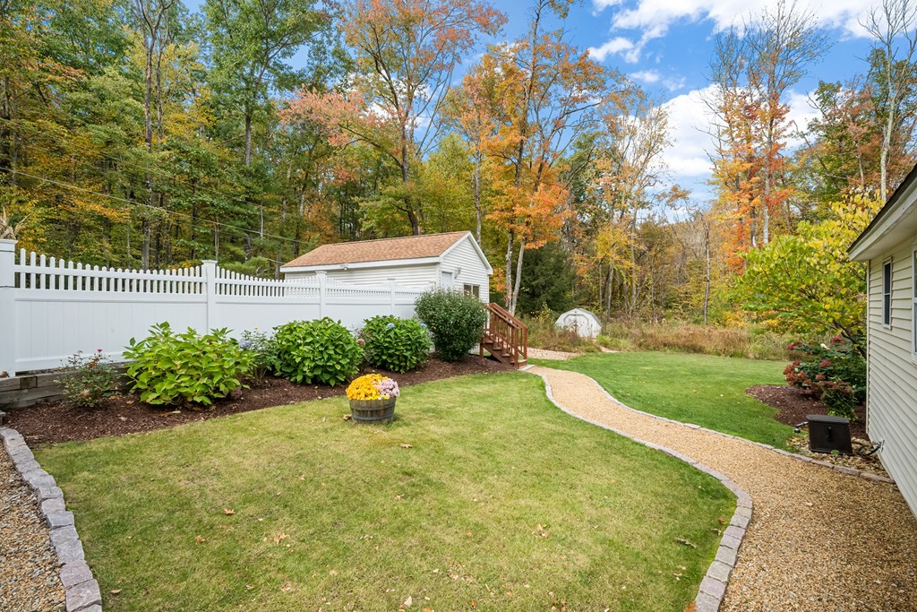 9 Tucker Lane Sutton, MA 01590 - Photo 31 of 33 a view of a backyard with a garden