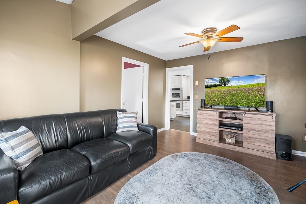 9 Tucker Lane Sutton, MA 01590 - Photo 7 of 33 a living room with furniture and a flat screen tv