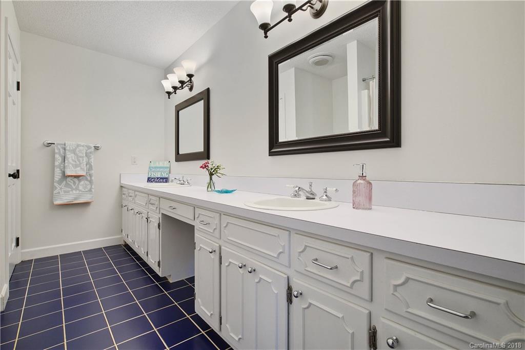 4592 Lake Shore Road North Denver, NC 28037 - Photo 22 of 30 a bathroom with a double vanity sink mirror and
