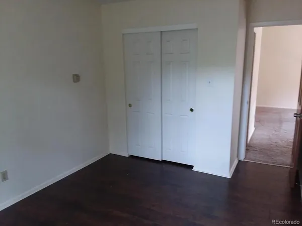 a bathroom with a granite countertop shower and a toilet
