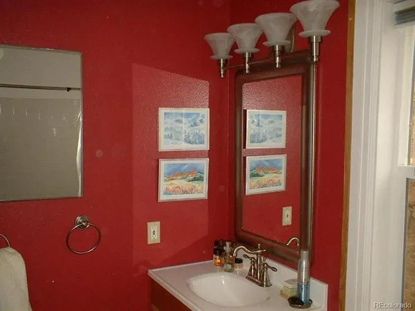 a view of entryway with a front door and wooden floor