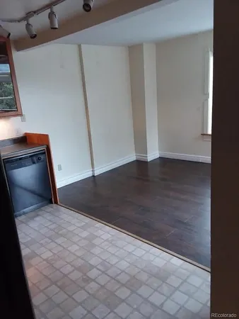 a view of entryway with wooden floor and stairs