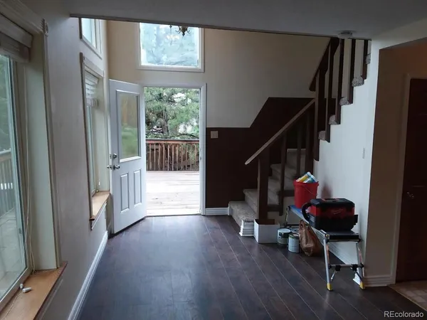 a view of entryway with wooden floor