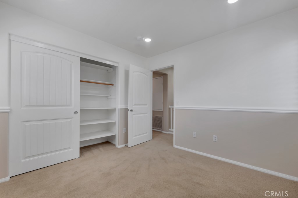 11522 Cararra Lane Porter Ranch, CA 91326 - Photo 15 of 32 a view of walk in closet with empty racks