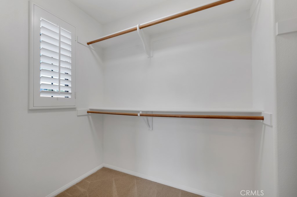 11522 Cararra Lane Porter Ranch, CA 91326 - Photo 19 of 32 a view of walk in closet with window