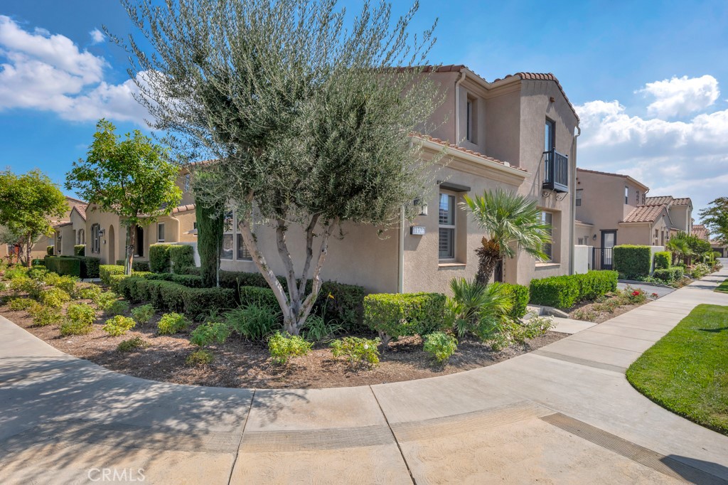 11522 Cararra Lane Porter Ranch, CA 91326 - Photo 3 of 32 a front view of a house with garden