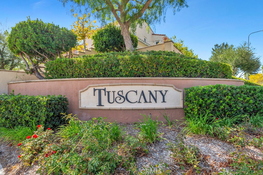 11522 Cararra Lane Porter Ranch, CA 91326 - Photo 32 of 32 a sign broad in front of a white house