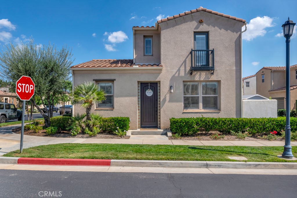 11522 Cararra Lane Porter Ranch, CA 91326 - Photo 4 of 32 a front view of a house with a yard