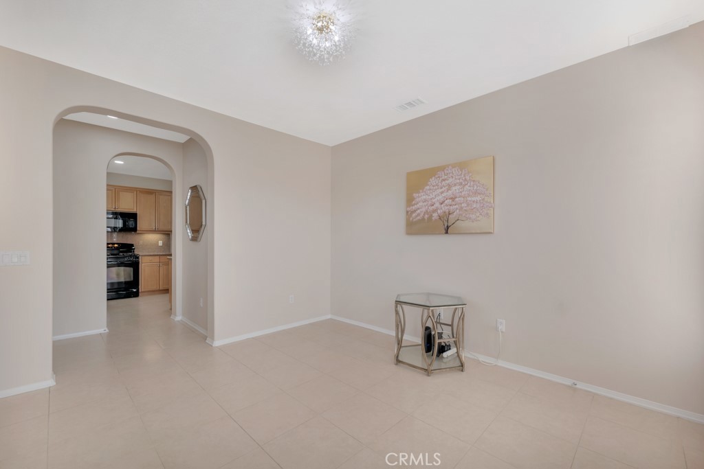 11522 Cararra Lane Porter Ranch, CA 91326 - Photo 5 of 32 an empty room with a bench and a hallway