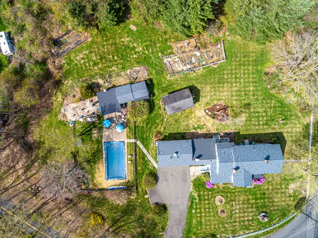 an aerial view of a house with a garden