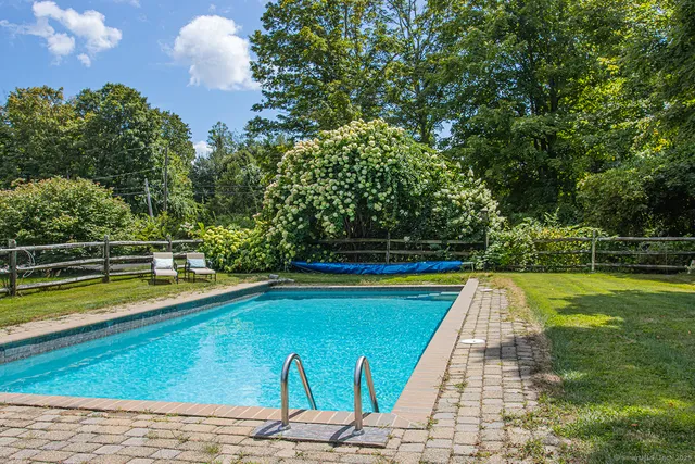 a view of a swimming pool with a lounge chair