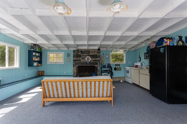a bathroom with a bed and a chandelier