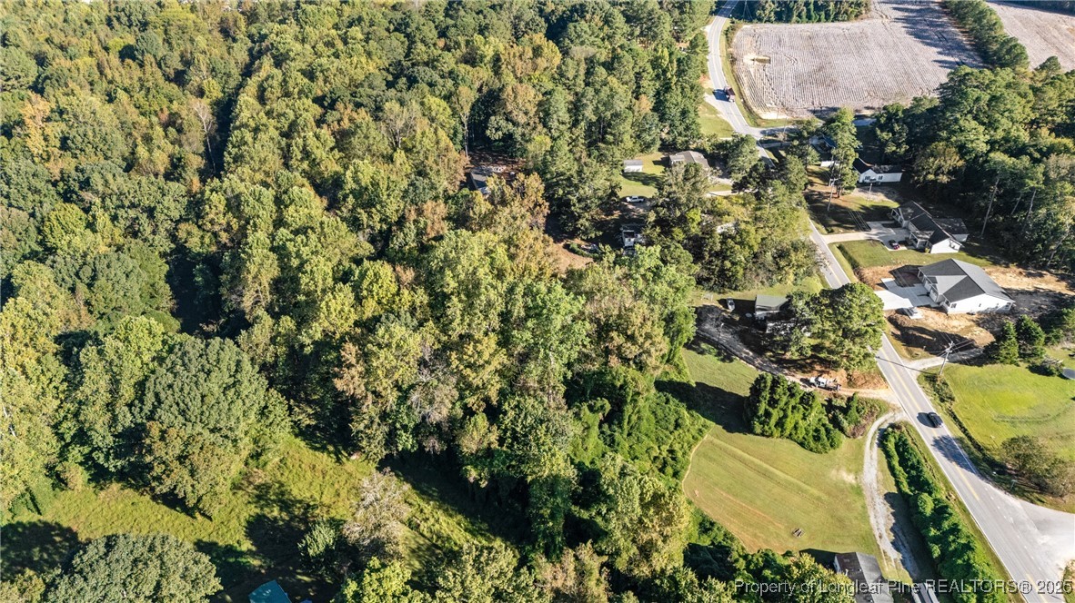 0 Fire Dept Road Clayton, NC 27527 - Photo 20 of 34 an aerial view of residential house with parking space and covered by trees