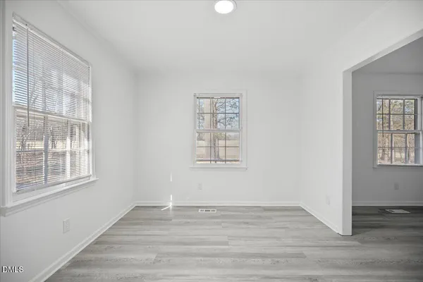 a view of kitchen with furniture and wooden floor