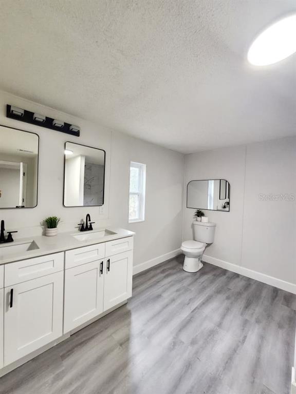 5641 South Butan Point Homosassa, FL 34446 - Photo 6 of 14 a room with two separate beds and a large mirror