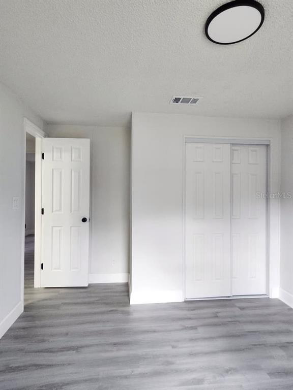 5641 South Butan Point Homosassa, FL 34446 - Photo 8 of 14 a view of a room with wooden floor and window