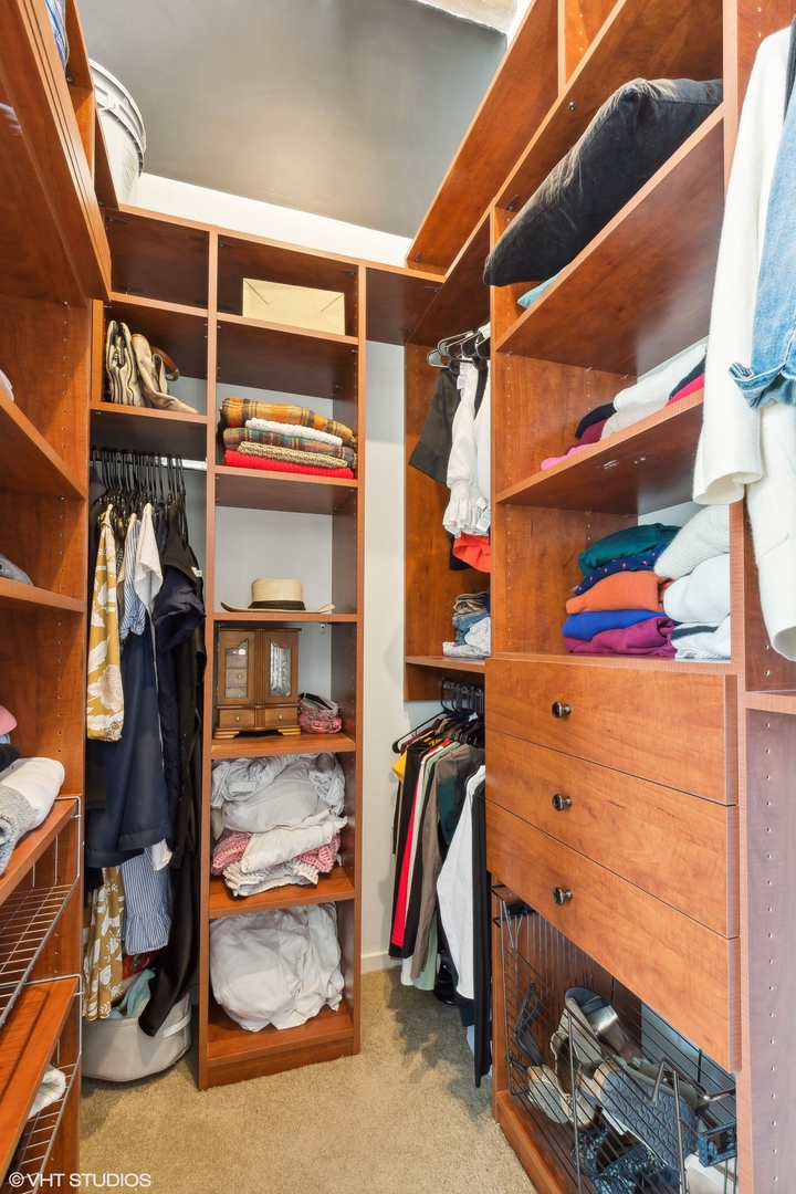 1040 West Adams Street, Unit 473 Chicago, IL 60607 - Photo 11 of 19 a view of walk in closet with clothes and shoes