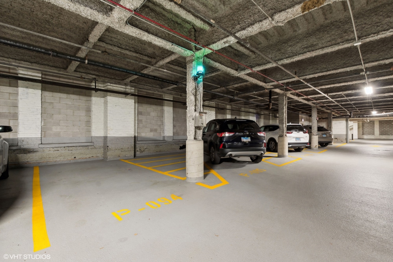 1040 West Adams Street, Unit 473 Chicago, IL 60607 - Photo 14 of 19 a view of garage with cars