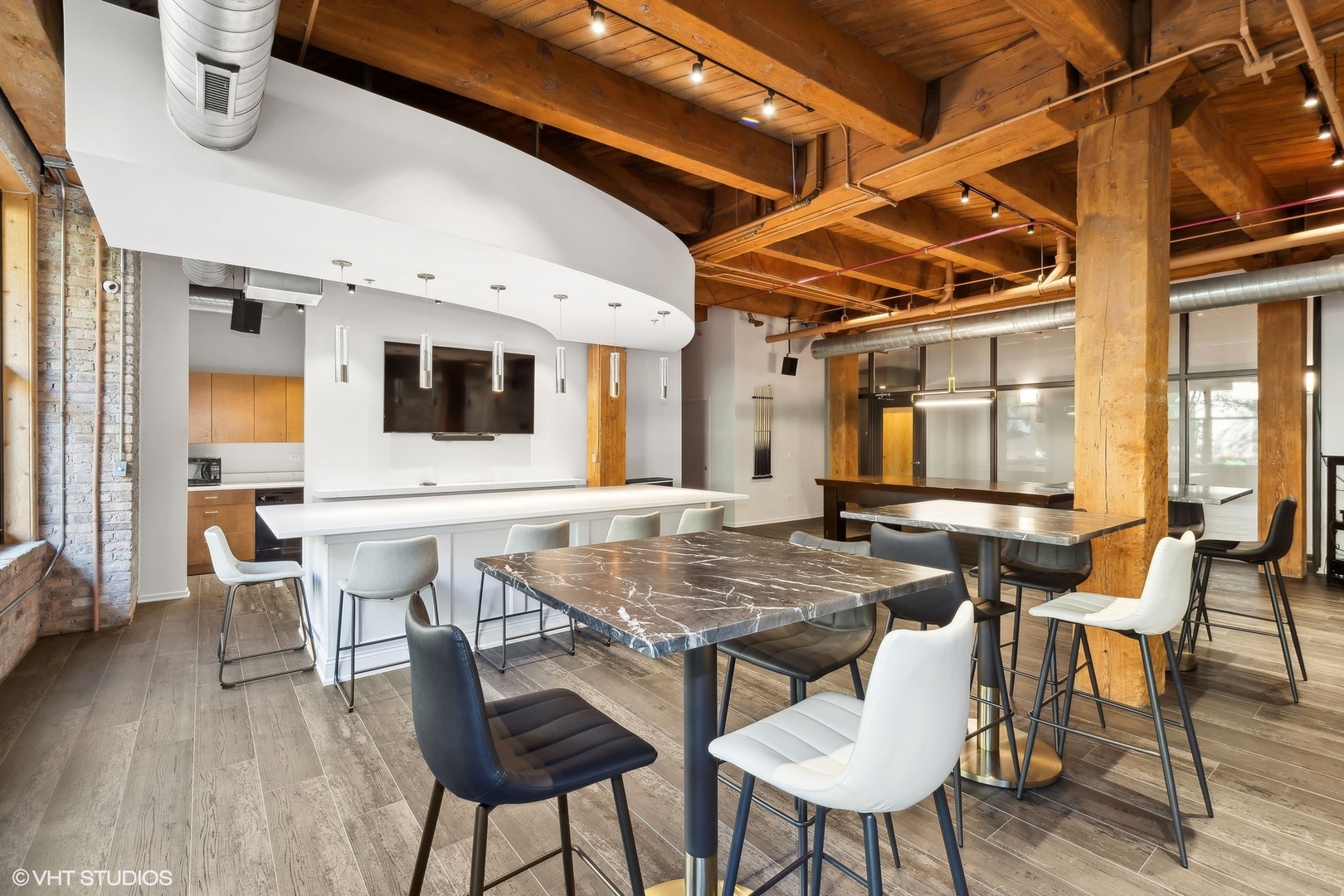 1040 West Adams Street, Unit 473 Chicago, IL 60607 - Photo 17 of 19 a view of a dining room with furniture and wooden floor